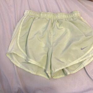 I am selling three pairs of medium nike dri-fit tempo brief-line running shorts.